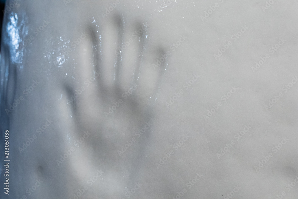 Prints of a human hand on a block of ice. handprint of the passage of man on a glacier. Prints of a human hand on a block of ice. handprint of the passage of man on a glacier.