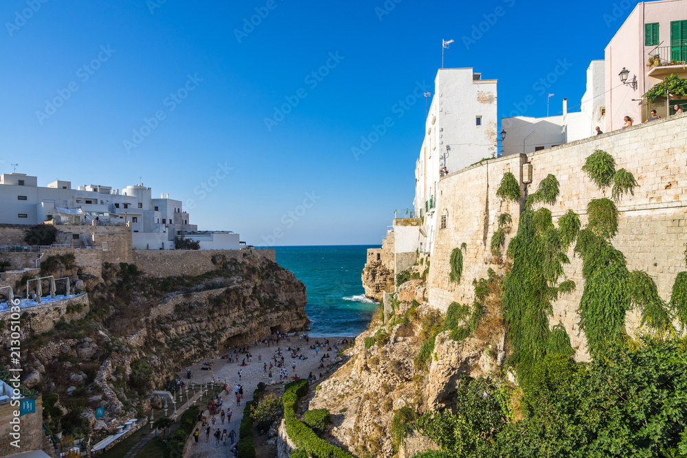 View of the famous Lama Monachile beach from the bastions of the old town, Polignano a Mare, Apulia, Italy