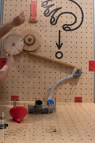 Wooden constructions to create a path to a ball. Educational activity for children and young people on the subject of engineering and mechanics. Tinkering and STEM approach for school education