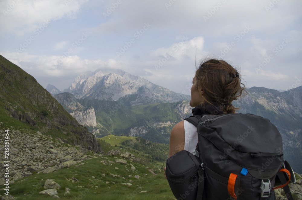 Girl backpacking her stuff and leaving for a trekking Girl backpacking her stuff and leaving for a trekking