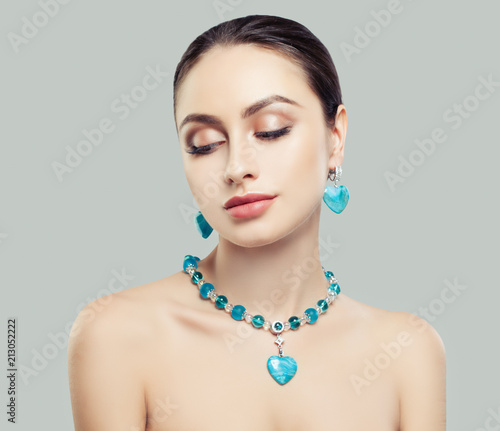 Beautiful Brunette Woman in Blue Jewelry Necklace and Earrings with Diamonds and Jasper, Fashion Beauty Portrait