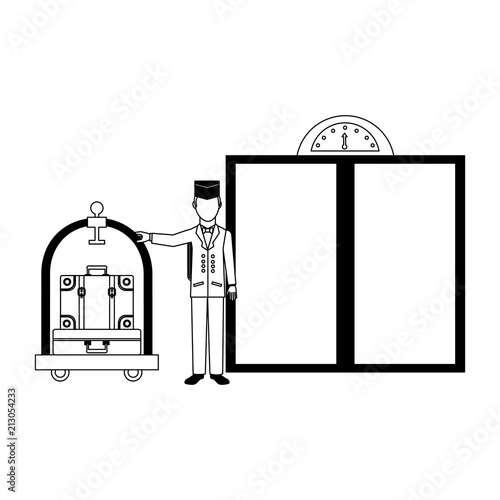hotel bellboy and luggage trolley suitcase elevator doors