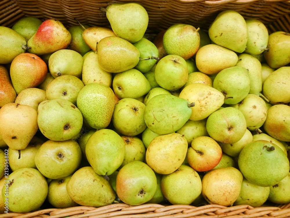 Green apples on the counter in the supermarket.