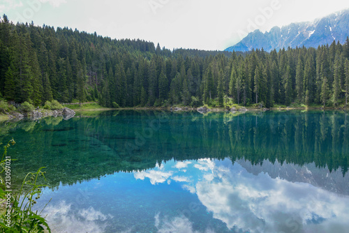 Fototapeta Naklejka Na Ścianę i Meble -  Lake Carezza with reflection of mountains in the Dolomites