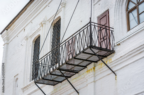 Iron balcony of the white building