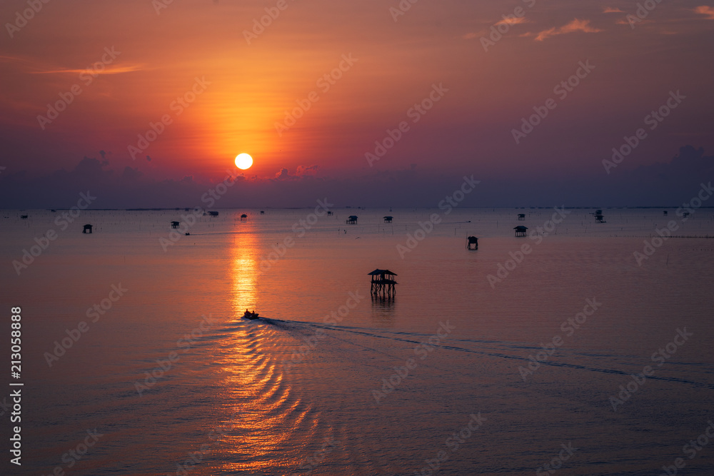 scenic of sunset skyline and boat on seascape