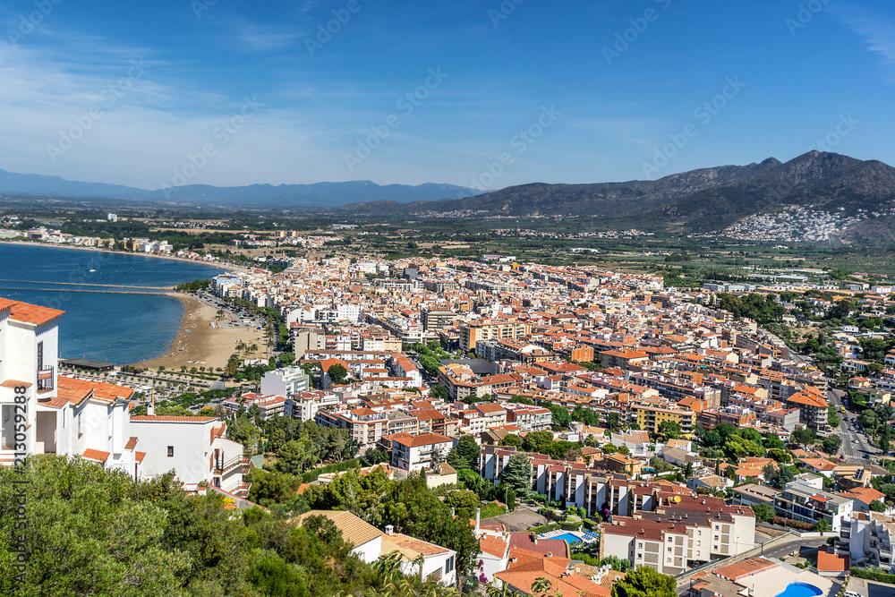 Looking across the rooftops of Roses to the beach and port on Cape Creus Costa Brava