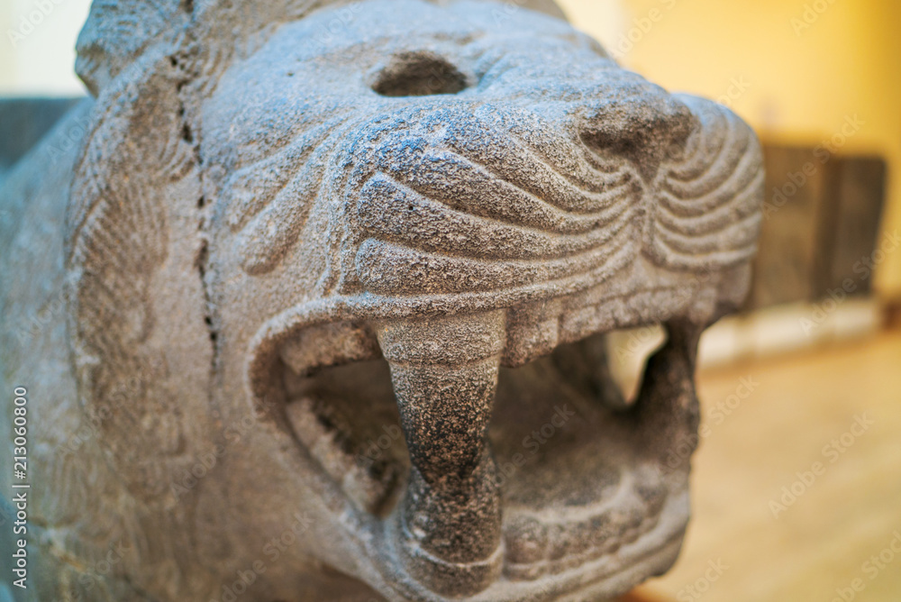 historical artifacts stone lion face