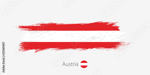 Flag of Austria, grunge abstract brush stroke on gray background.