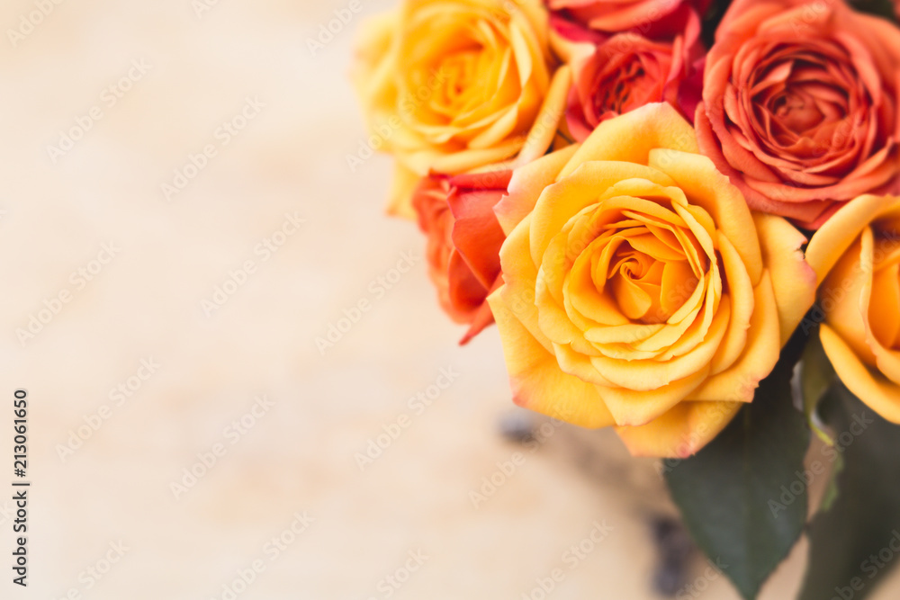 Orange and Yellow Roses in a Tarnished Silver Vase on Plaster Board Orange and Yellow Roses in a Tarnished Silver Vase on Plaster Board