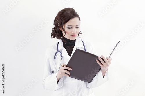 female doctor making notes in the medical record.
