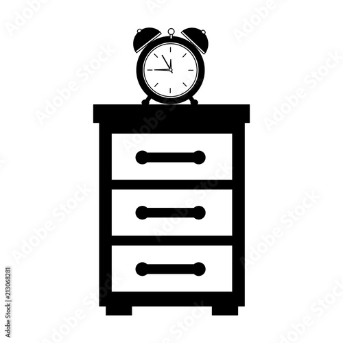 wooden bedside table and clock alarm