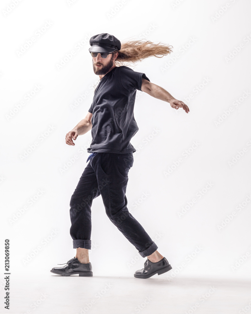 Young beautiful dancer posing in the studio