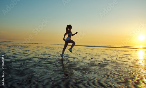 girl running by the sea on the beach © Fanfo