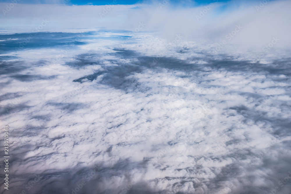 cloud and blue sky view from window of airplane