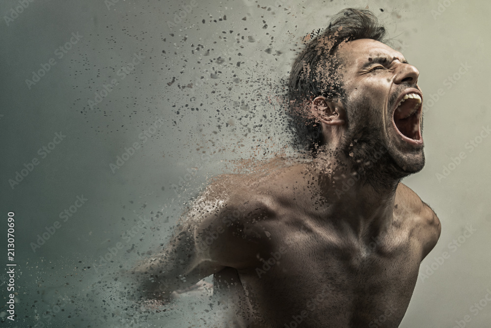 Screaming frustrated man dispersing and disintegrating into particles, agonizing and torturing expression