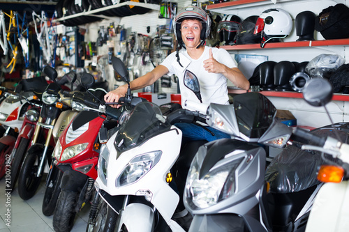 guy sitting on the motorbike  with helmet