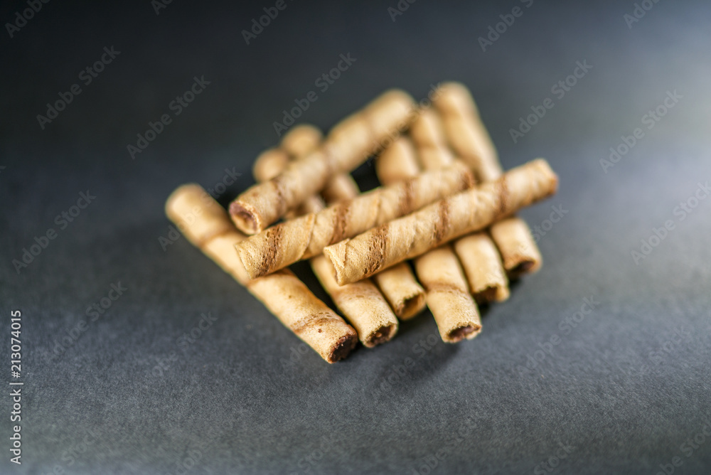 delicious cream filled wafers on the black background