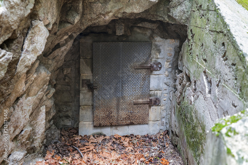 Old mine entrance metal door in the Angeles National Forest area of the popular San Gabriel Mountains above LA and Pasadena California.   photo