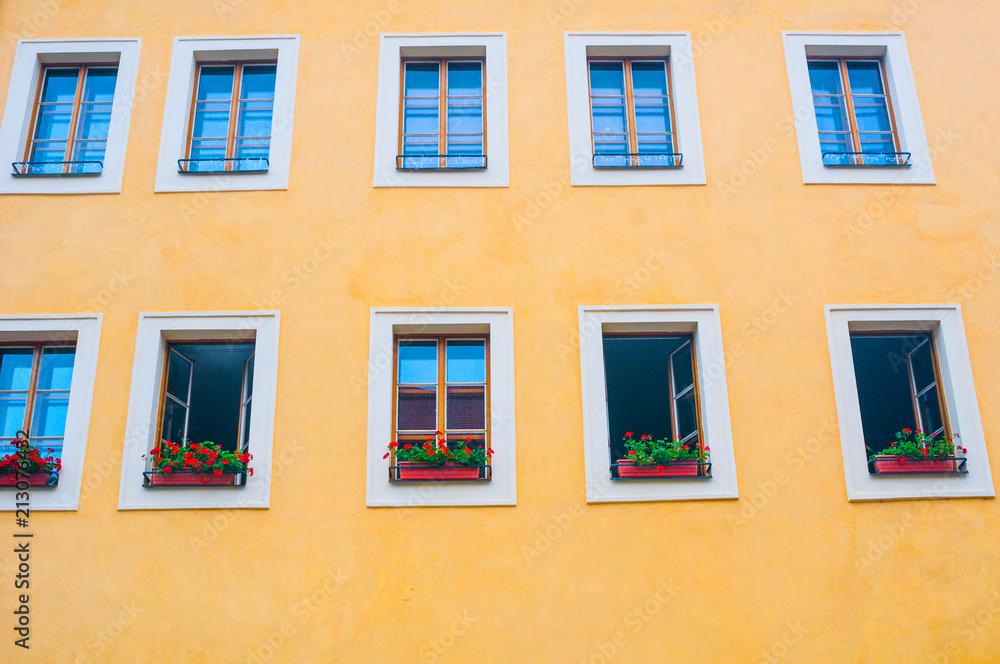 Facade of yellow building with windows