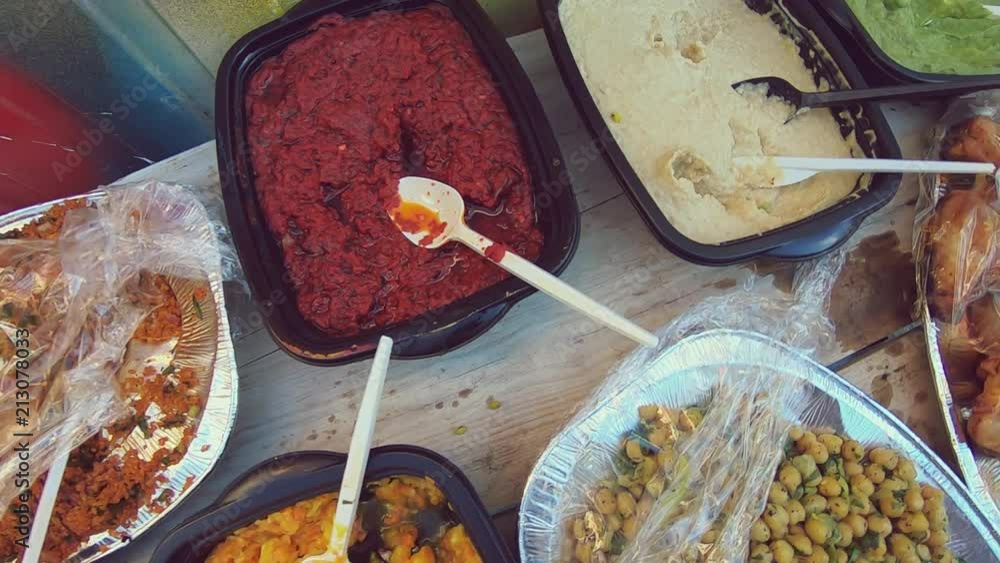 Traveling Shot Over A Colourful Food Buffet With Plastic Containers