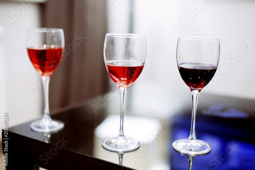 Glasses of wine red standing on a table