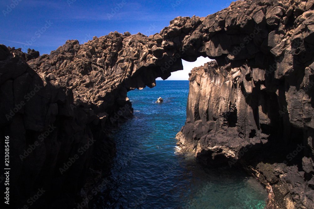 Stunning natural rocky arch above ocean Stunning natural rocky arch above ocean