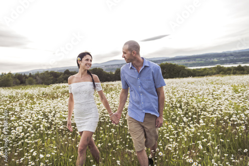 couple in love outdoor at the sunset daisy