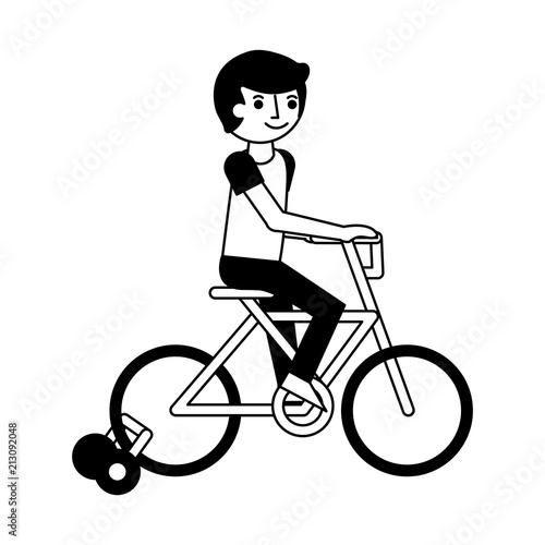 little boy in bicycle with auxiliary rims
