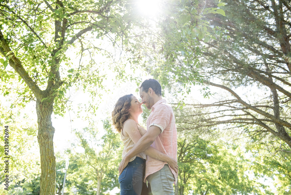 man and woman posing in the park man and woman posing in the park