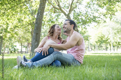 man and woman posing in the park