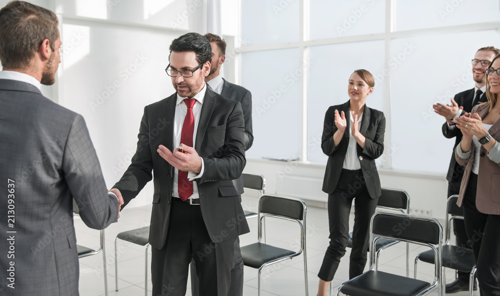 handshake after the completion of a new project plan handshake after the completion of a new project plan