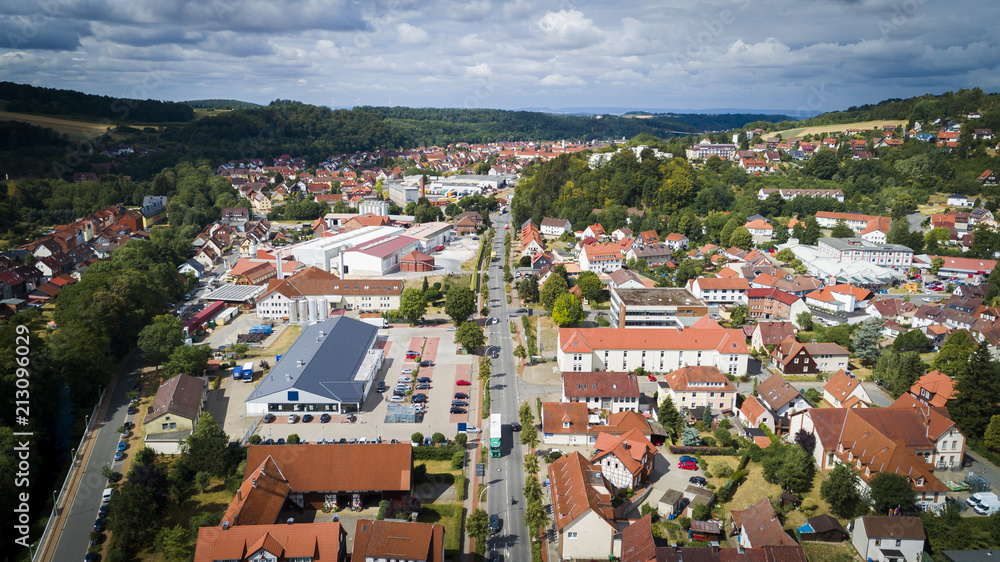 Aerial drone bird's eye view photo of famous and picturesque european village of central germany with red roofs and cozy streets