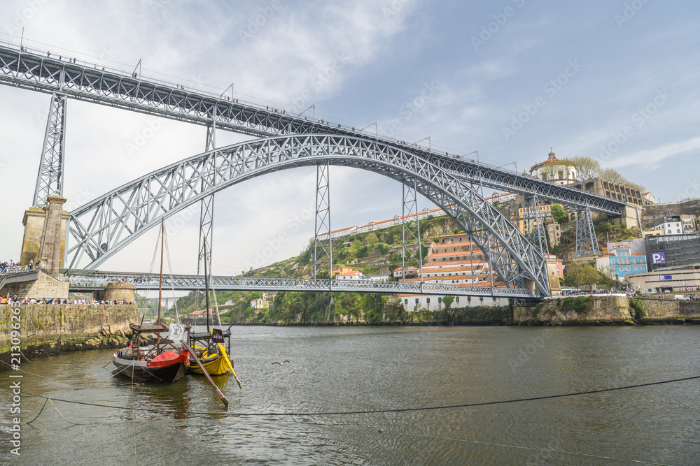 Mass of tourists walking near Dom Luis I bridge in Porto