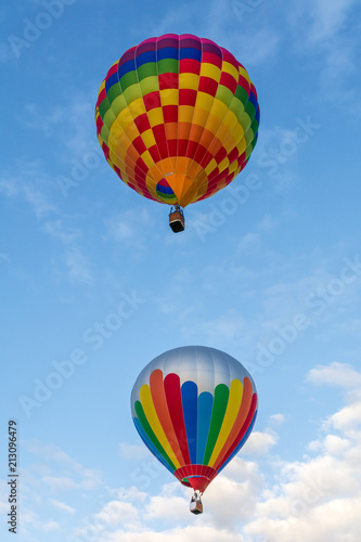 Hot air balloon under blue sky. © vivoo