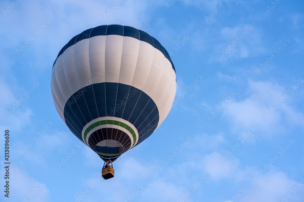 Fototapeta premium Hot air balloon under blue sky.