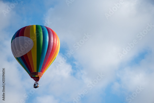 Hot air balloon under blue sky.