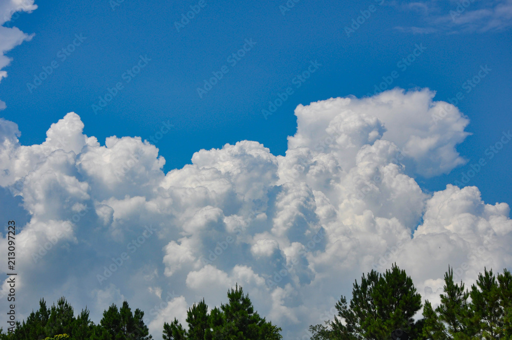 Fluffy White Clouds in Blue Sky Fluffy White Clouds in Blue Sky