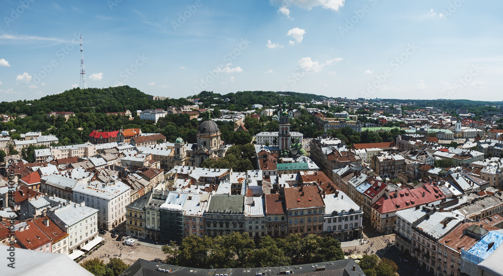 City view of Lviv historical center with its beautiful architecture from Medieval Town Hall. Lviv old city panorama with old roofs of Italian Courtyard, Dominican church and monastery, Rynok Square