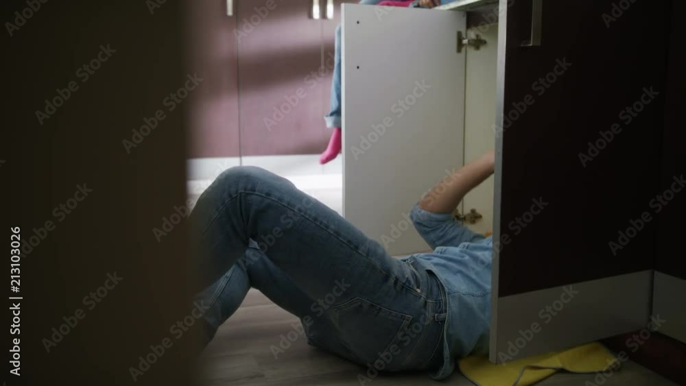 Handyman Husband and Wife Repairing Kitchen Sink Handyman Husband and Wife Repairing Kitchen Sink