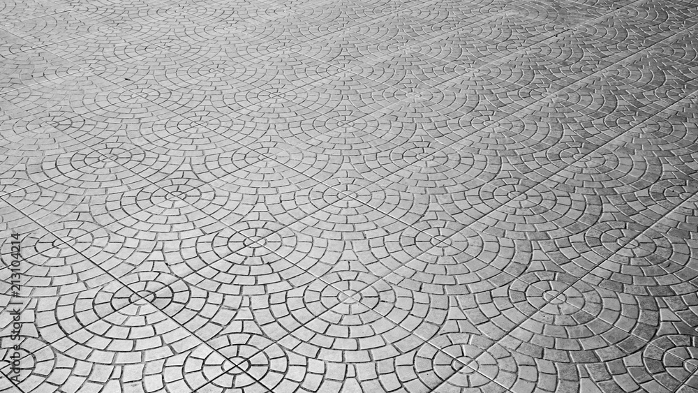 patterned paving tiles, ceramic brick floor background - monochrome