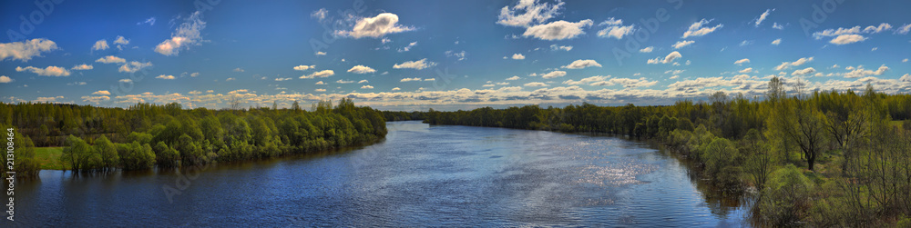 Panorama of the full-flowing, spring river