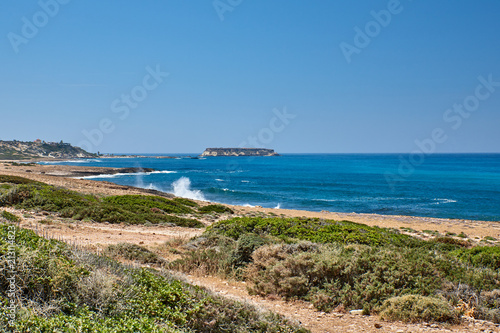 Cyprus. Peyia. The road to Avakas. Behind remained the church of St. George and the island of Kyonas