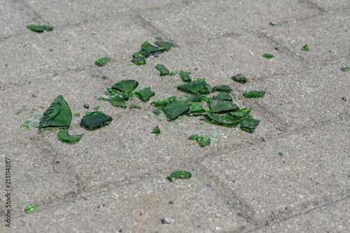 Photography Dangerous shards of glass. Broken bottle on the sidewalk.