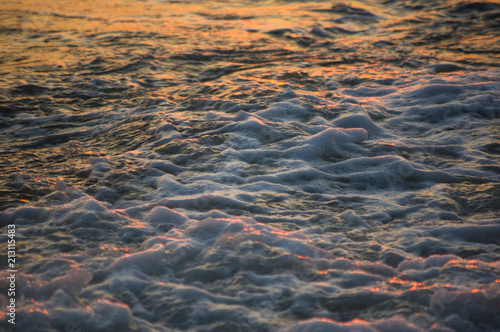 pebble stones on the sea beach  the rolling waves of the sea with foam