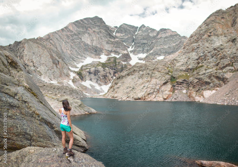 Woman and Rocky Mountain Lake