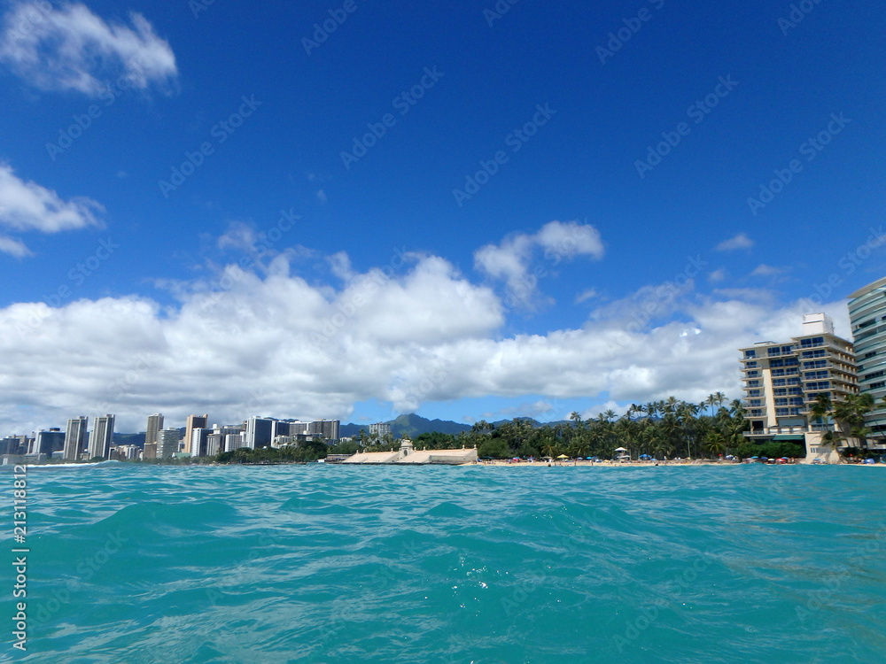 Historic Natatorium, Waikiki, Condomiums, Honolulu cityscape and San Souci Beach, coconut trees and lifeguard tower