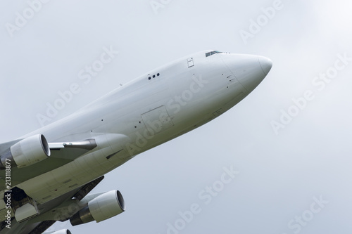 Close-up on a white cargo Boeing 747 taking off