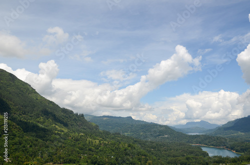 Mountain landscape in a green valley with the villages. View of Kotmale Reservoir, Sri Lanka.