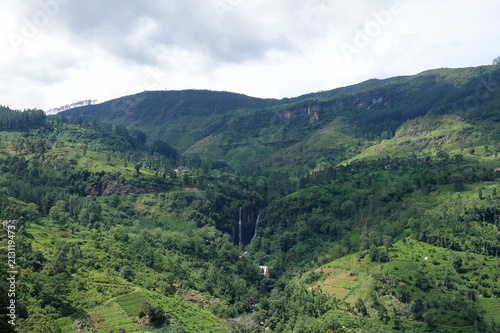 Mountain landscape in a green valley. View of Puna Waterfall in Central Province, Sri Lanka